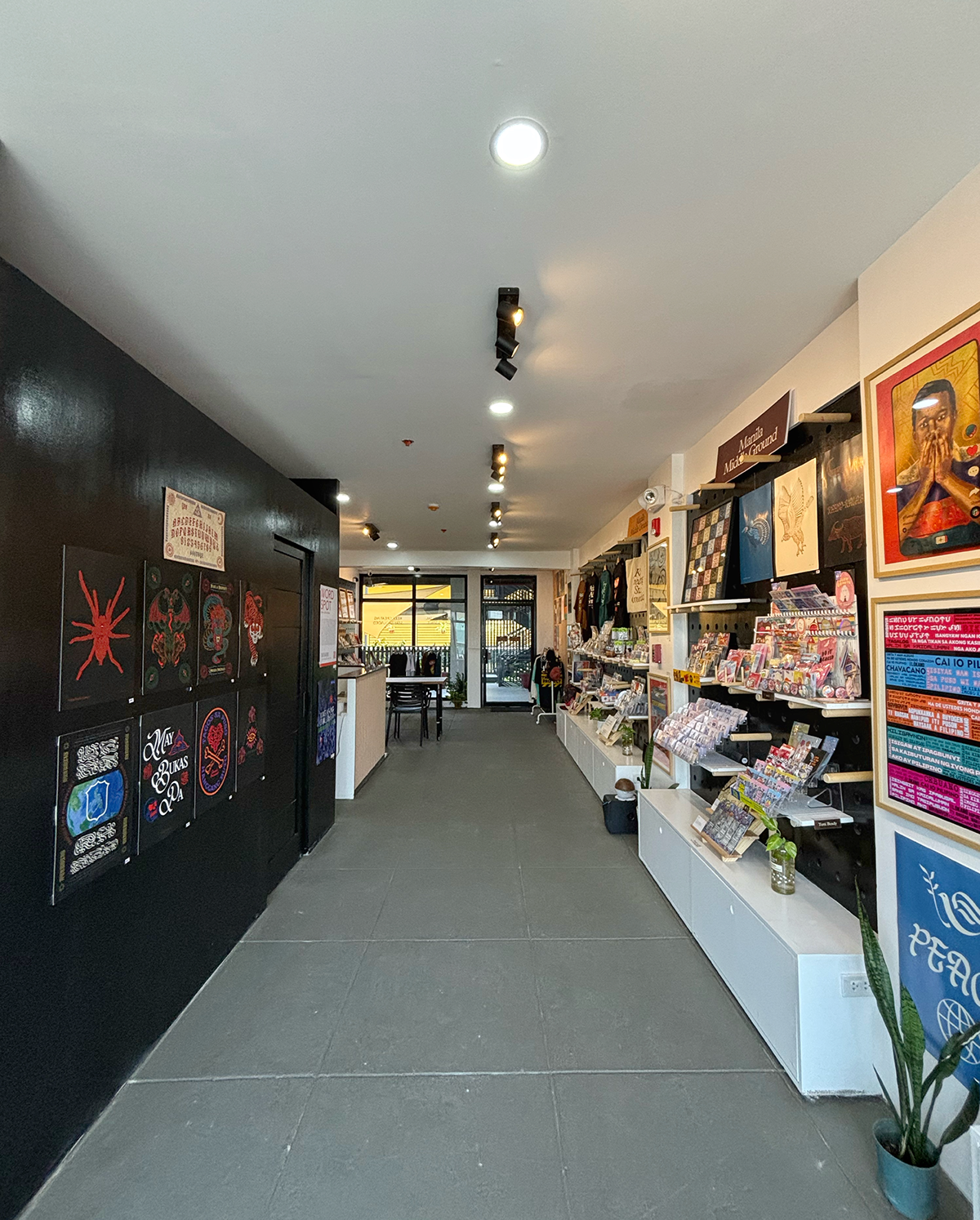 Interior corridor of Manila Middle Ground showing art displays and merchandise