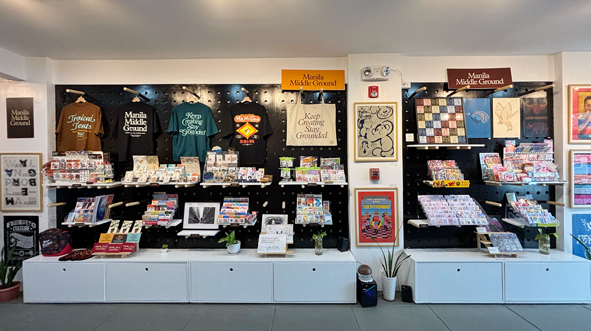 Pegboard wall filled with art merchandise from local artists